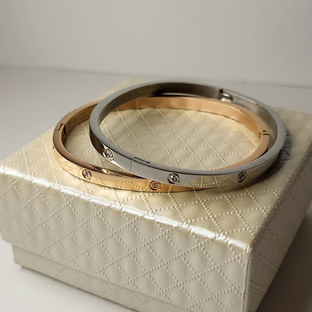 2 bracelets silver and gold